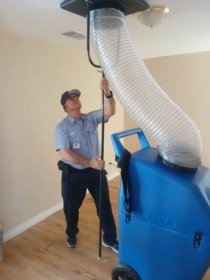 Furnace Tune-Up technician using HEPA equipment in Lynnfield